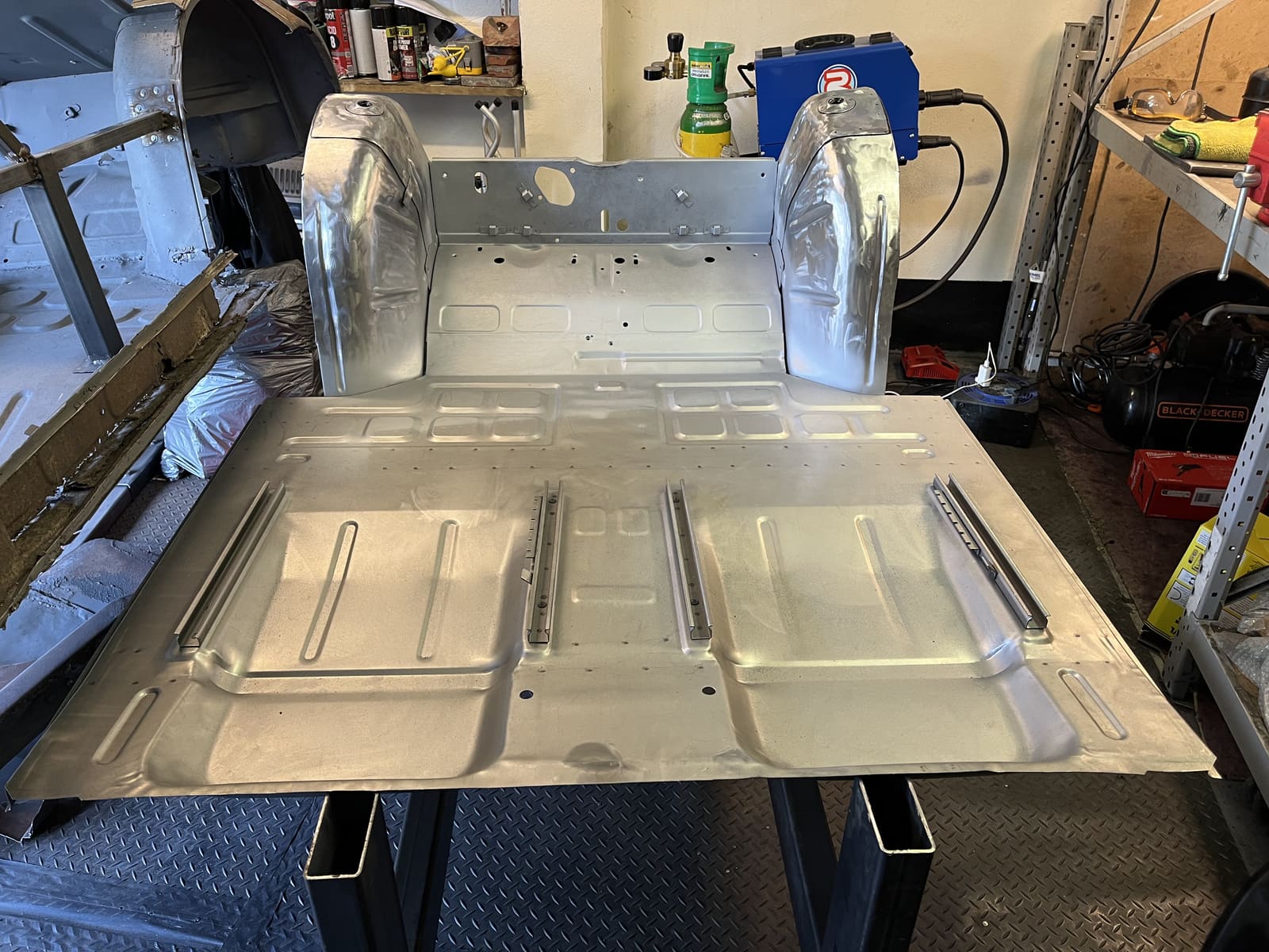 Freshly fabricated floor pan on the workbench