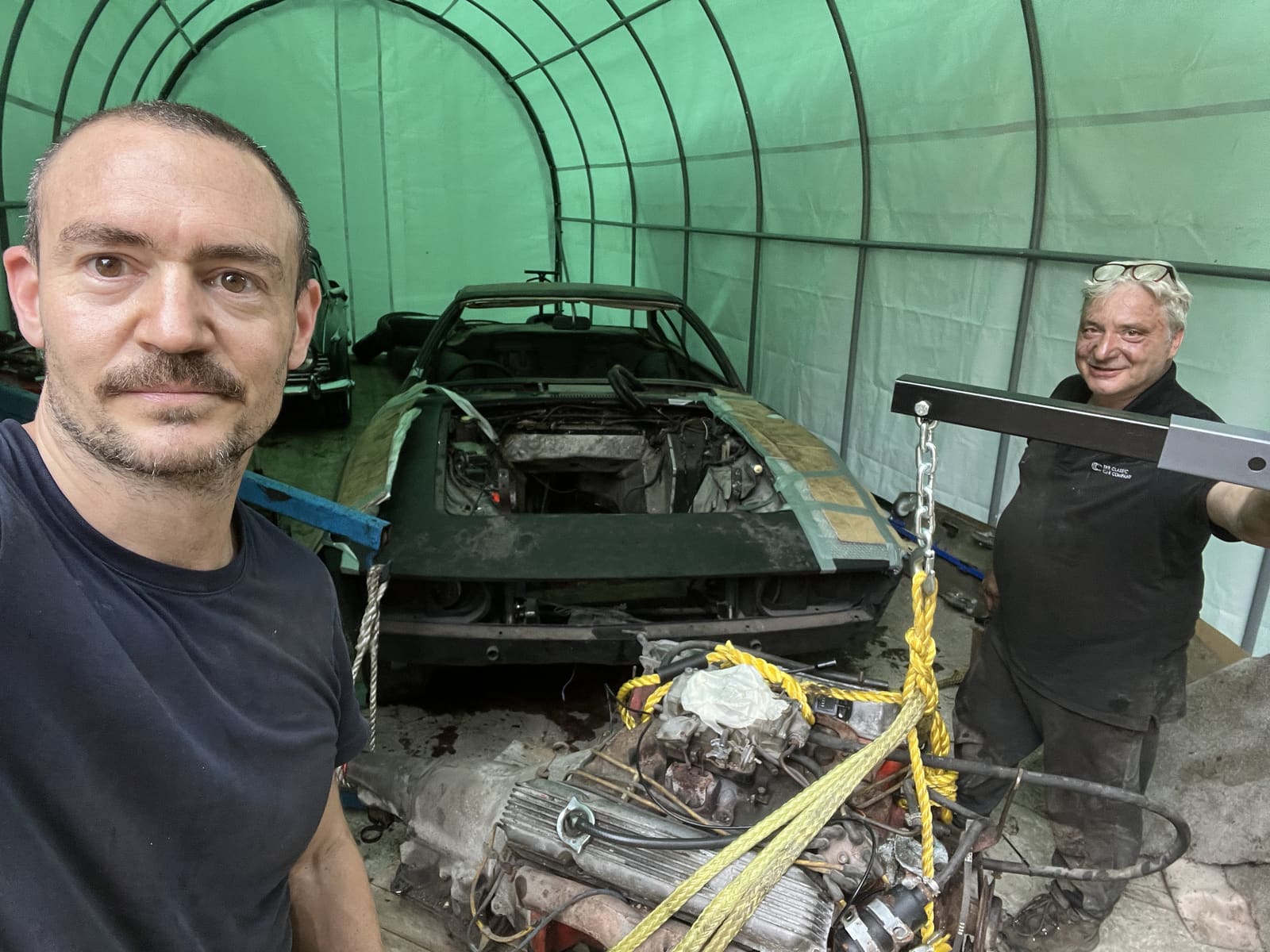 SL Works team hoisting an engine during a restoration