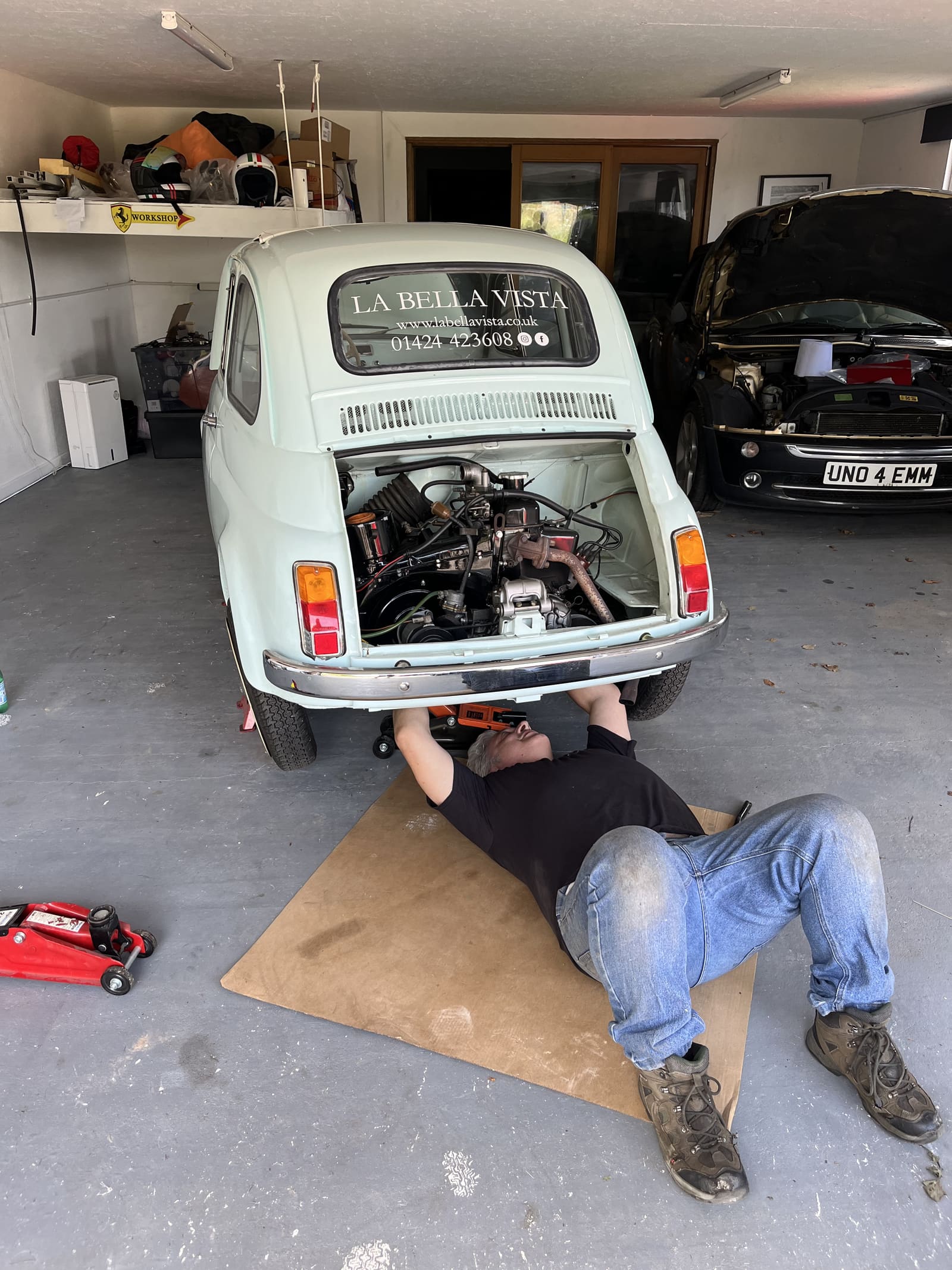 Classic Fiat 500 with engine bay serviced from below